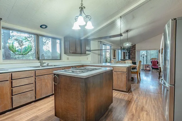 a kitchen with lots of counter top space and stainless steel appliances