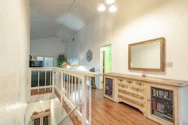 a view of a balcony with wooden floor