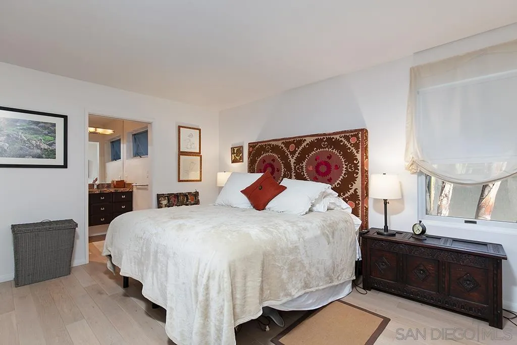 940 Sealane Drive, Unit 3 Encinitas, CA 92024 - Photo 11 of 23 a bedroom with a bed and dresser