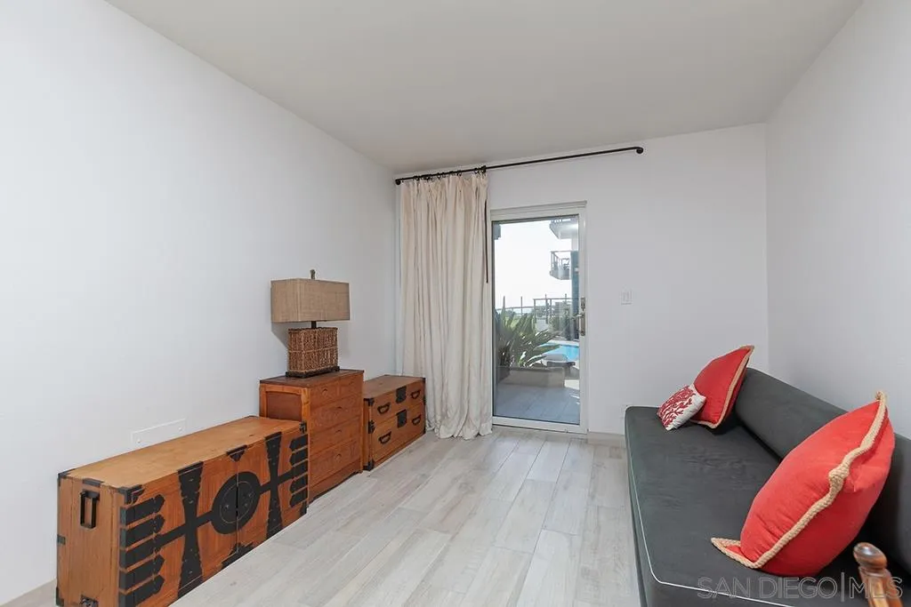 940 Sealane Drive, Unit 3 Encinitas, CA 92024 - Photo 14 of 23 a living room with furniture and a wooden floor