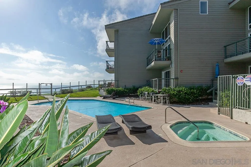 940 Sealane Drive, Unit 3 Encinitas, CA 92024 - Photo 20 of 23 a view of swimming pool with outdoor seating and plants