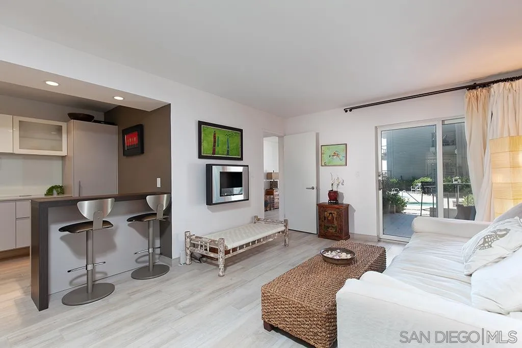 940 Sealane Drive, Unit 3 Encinitas, CA 92024 - Photo 3 of 23 a living room with furniture and a flat screen tv