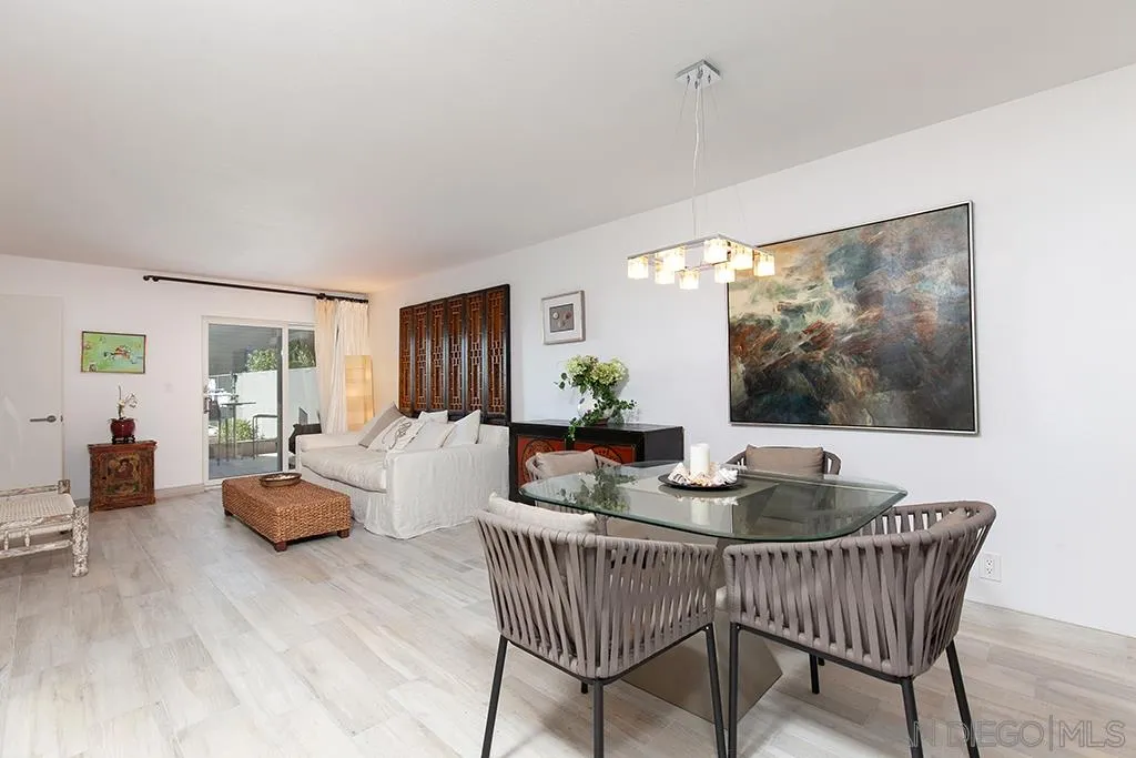 940 Sealane Drive, Unit 3 Encinitas, CA 92024 - Photo 5 of 23 a dining room with furniture and wooden floor