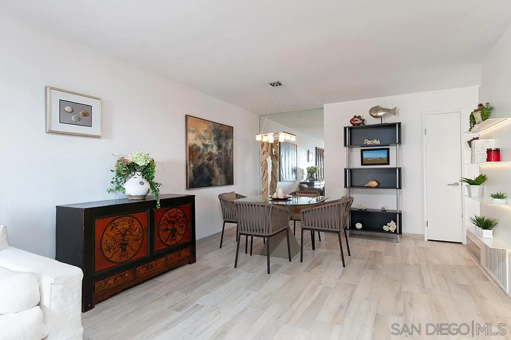 940 Sealane Drive, Unit 3 Encinitas, CA 92024 - Photo 6 of 23 a living room with furniture and paintings on the wall