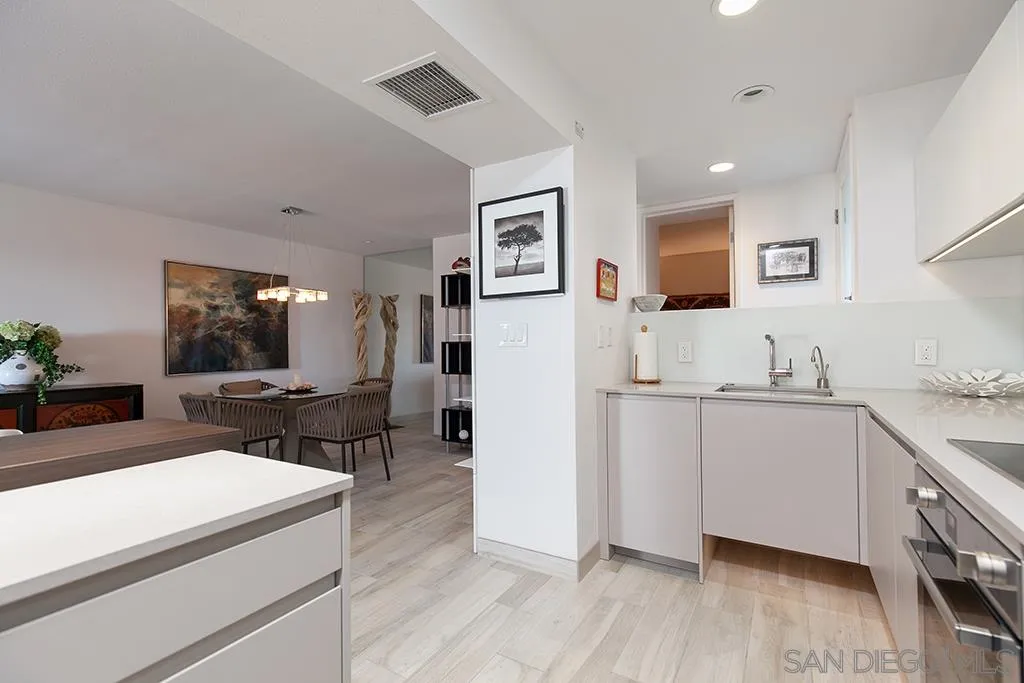940 Sealane Drive, Unit 3 Encinitas, CA 92024 - Photo 10 of 23 a living room with stainless steel appliances kitchen island granite countertop furniture and a refrigerator