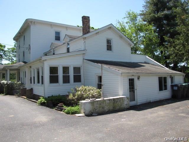 224 Reservoir Road Goshen, NY 10924 - Photo 1 of 1 a front view of a house with a yard and garage