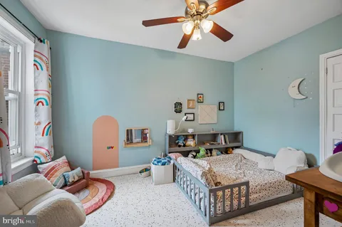 a bedroom with furniture and a chandelier