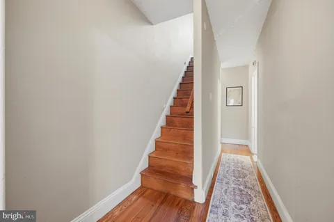 a view of entryway with wooden floor