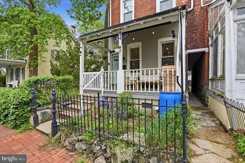 front view of a house with a small yard