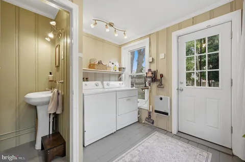 a bathroom with a sink and mirror