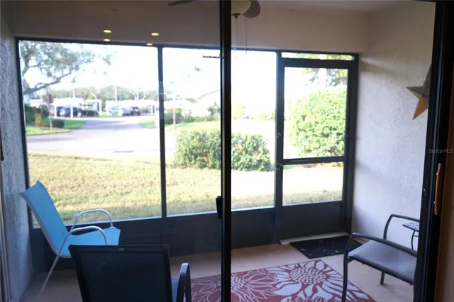 a bedroom with a bed and a chair