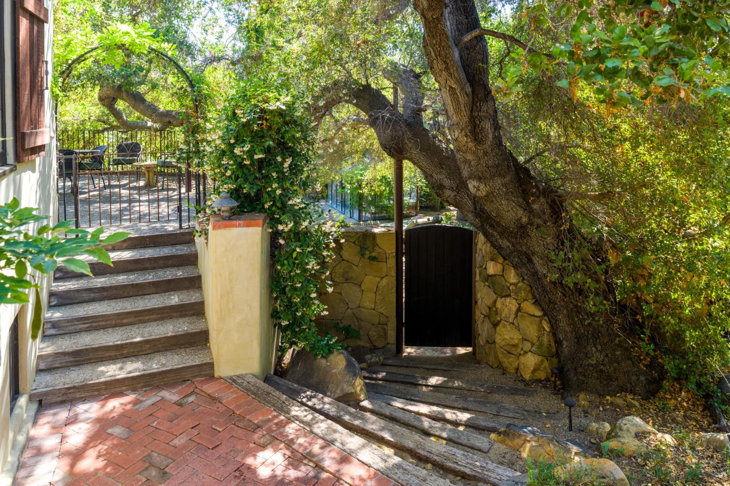 520 Foothill Road Ojai, CA 93023 - Photo 16 of 45 a view of a house with backyard and trees