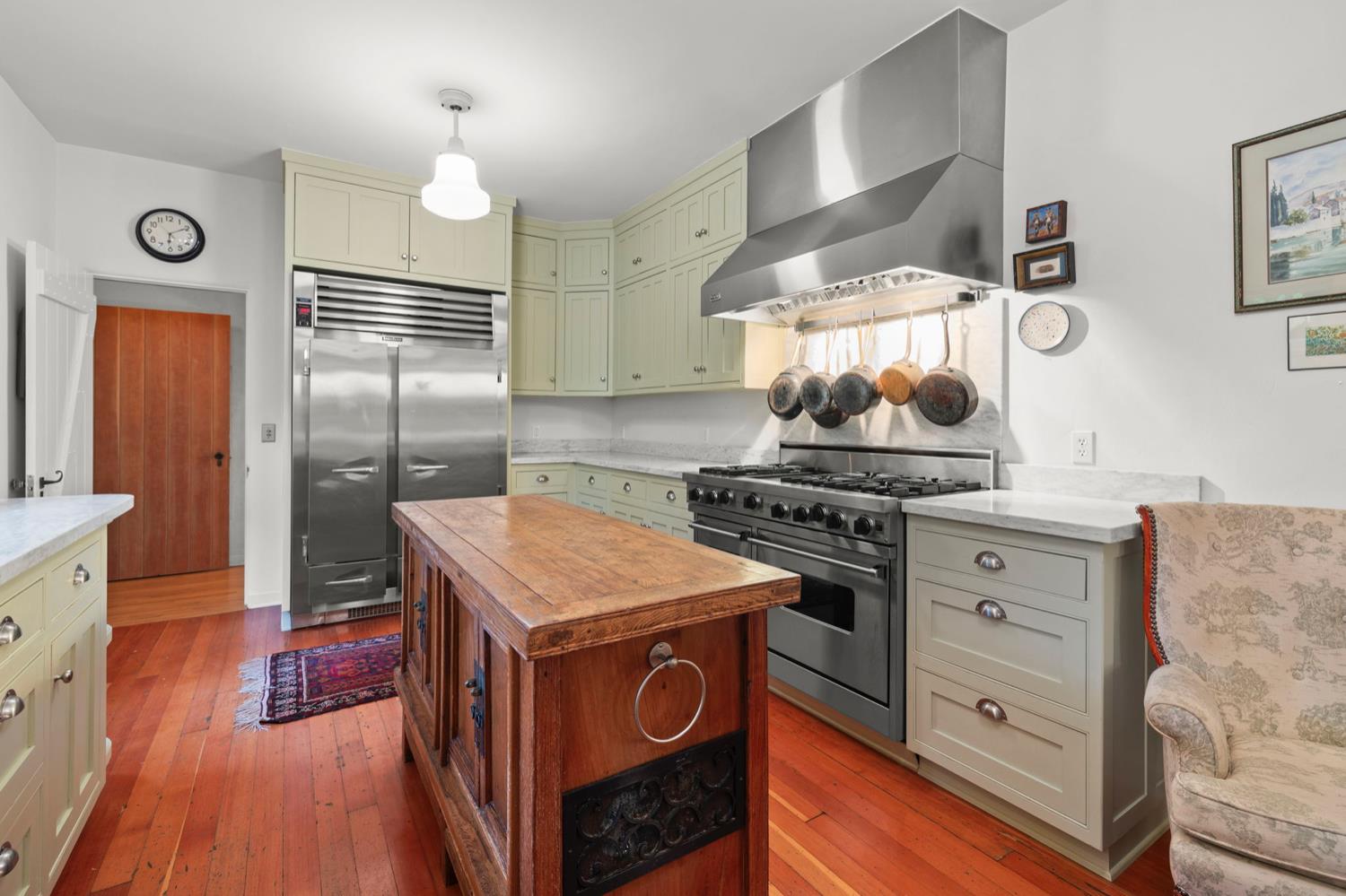 520 Foothill Road Ojai, CA 93023 - Photo 22 of 45 a kitchen with a stove cabinets and wooden floor