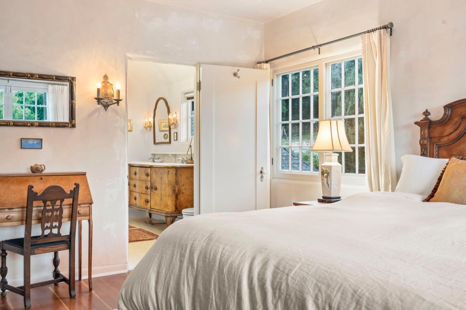 520 Foothill Road Ojai, CA 93023 - Photo 27 of 45 a bedroom with a bed and a large window with the outer view