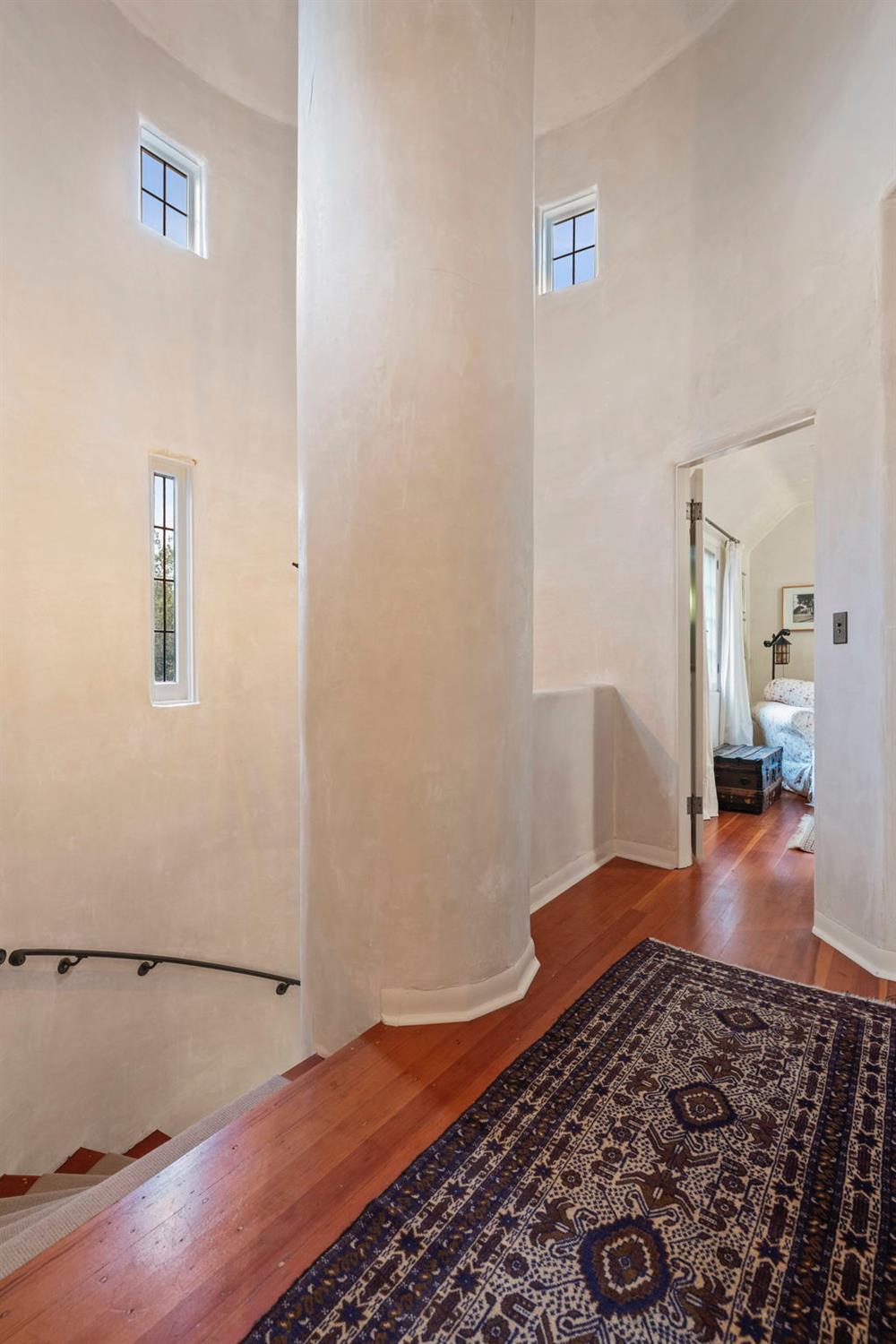 520 Foothill Road Ojai, CA 93023 - Photo 34 of 45 a bedroom with a bed and wooden floor