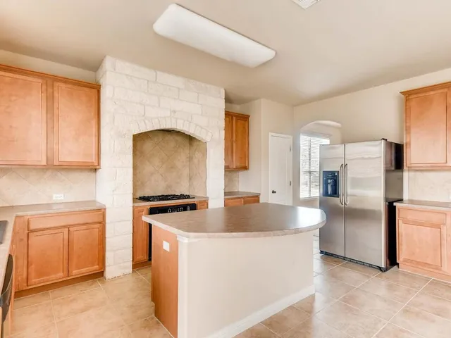 a kitchen with sink cabinets and a counter top space