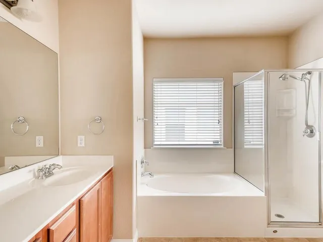 a bathroom with a bathtub and a sink