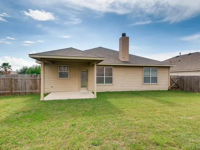 a front view of a house with yard