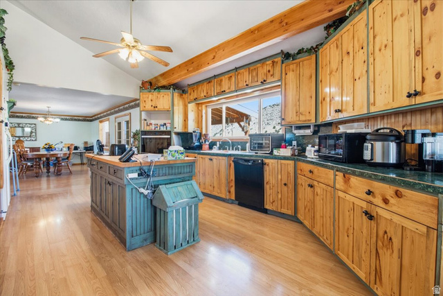 811 East Canyon Road Mayfield, UT 84643 - Photo 12 of 57 Spacious kitchen featuring natural wood cabinetry, wood-finish flooring, a central island, and an integrated dishwasher