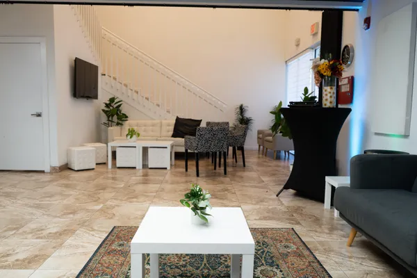 a living room with furniture and a fireplace