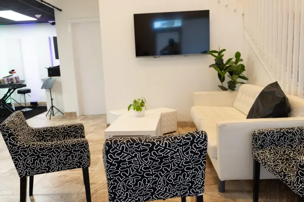 a table with a potted plant and a a window
