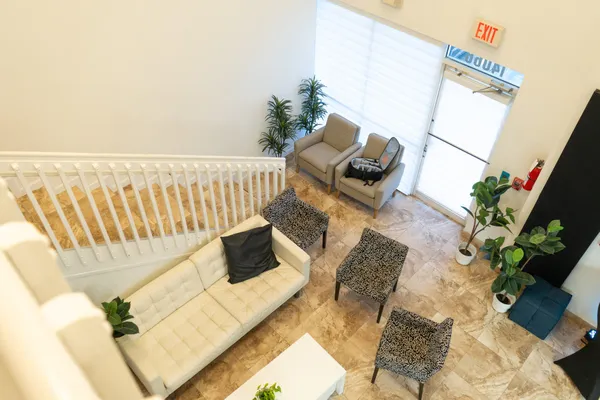 a living room with furniture and a rug