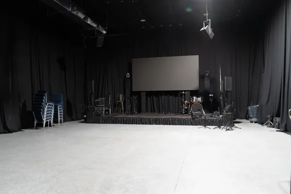 a room with furniture and musical instruments