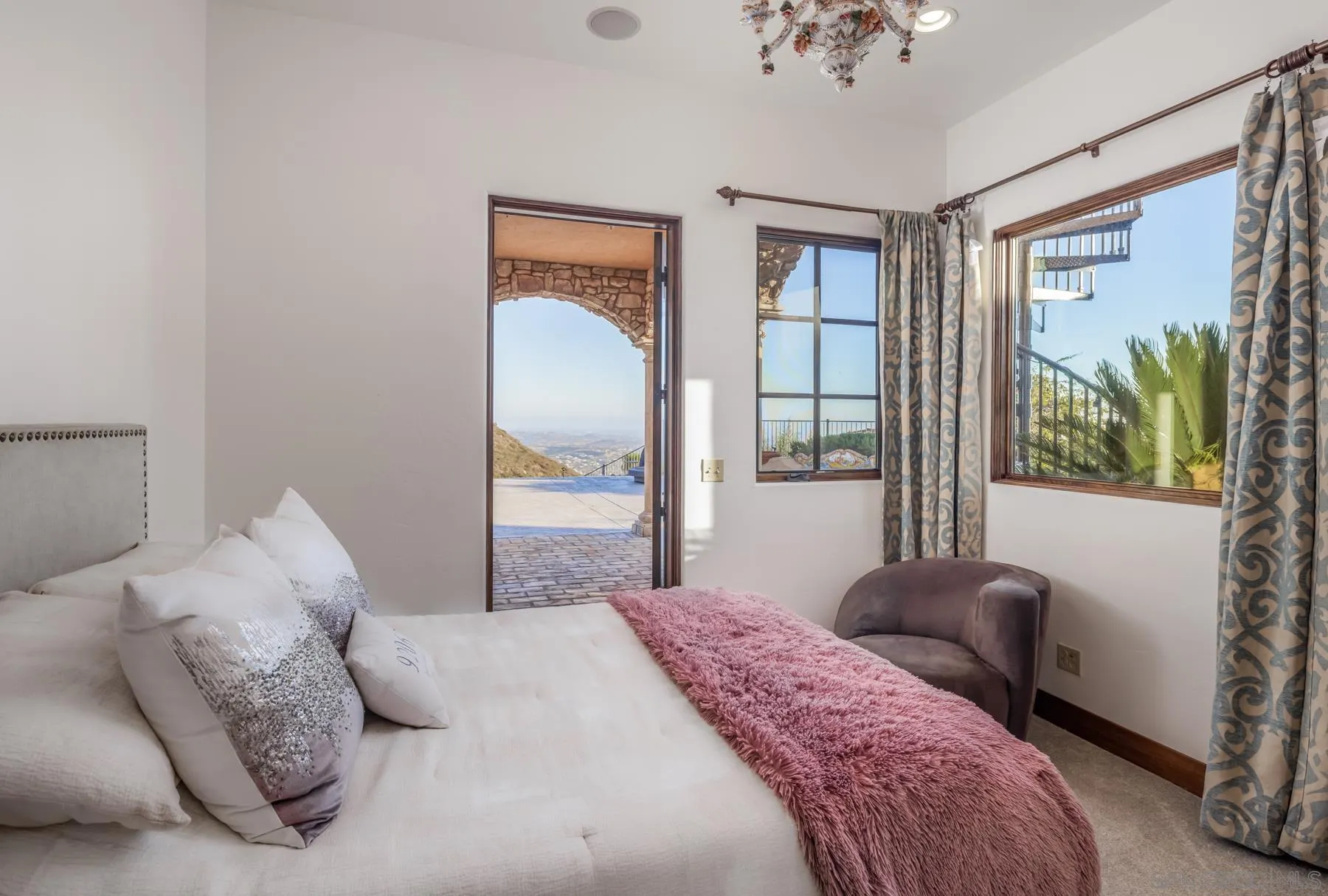 18113 El Brazo Rancho Santa Fe, CA 92067 - Photo 18 of 33 a bedroom with a large bed and a window