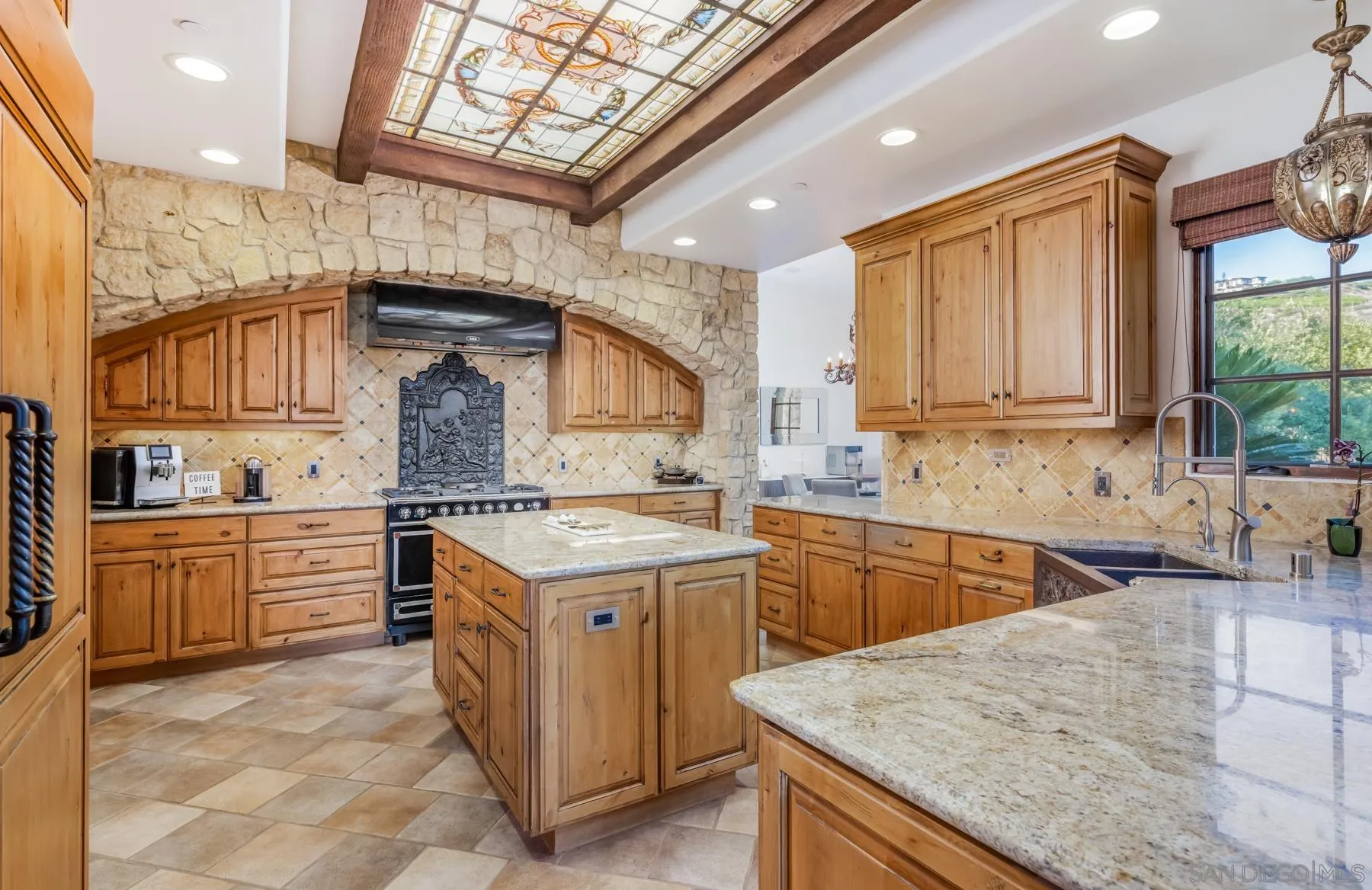 18113 El Brazo Rancho Santa Fe, CA 92067 - Photo 10 of 33 a kitchen with a sink stove and cabinets