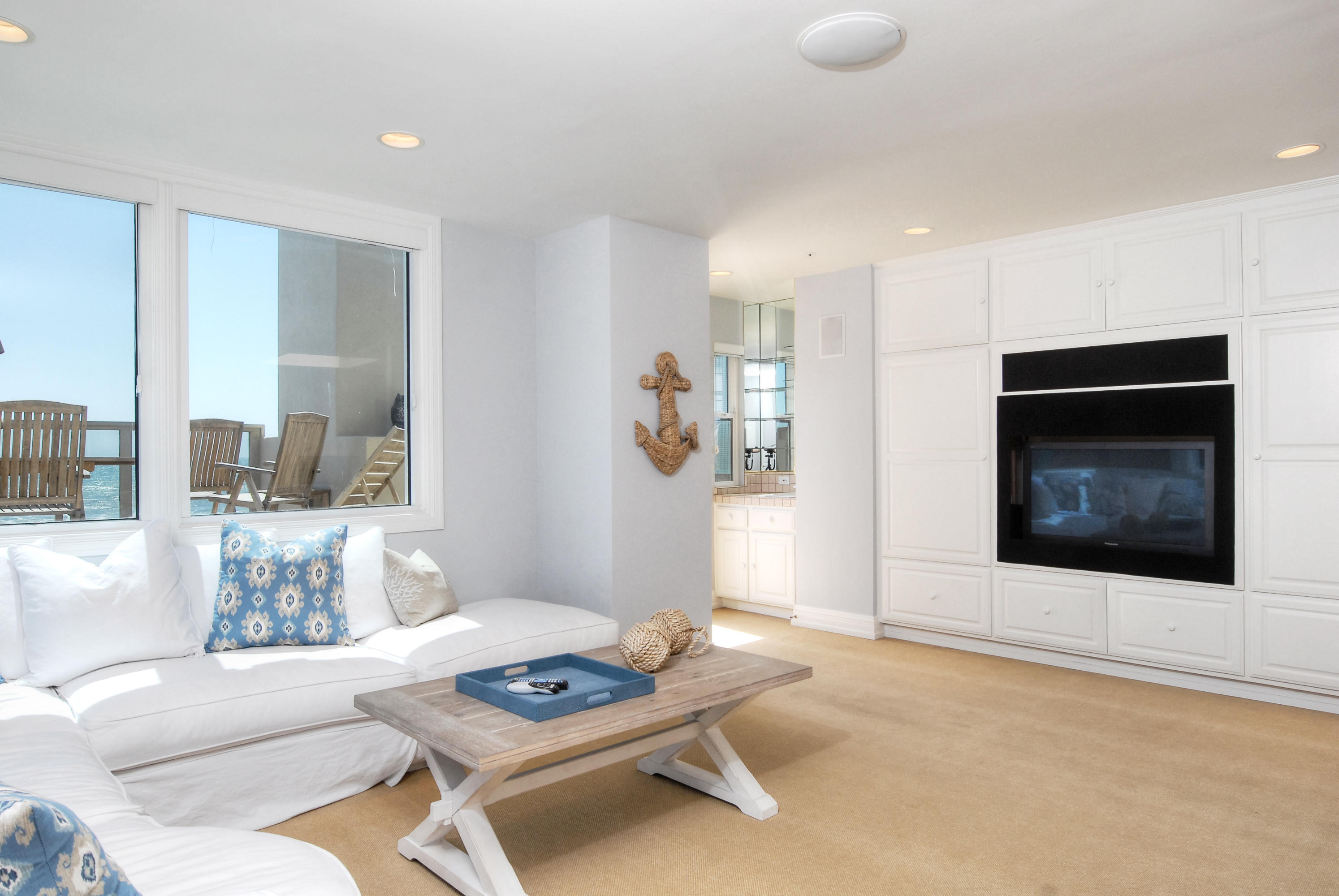 681 Mandalay Beach Road Oxnard, CA 93035 - Photo 19 of 39 a living room with furniture and a fireplace