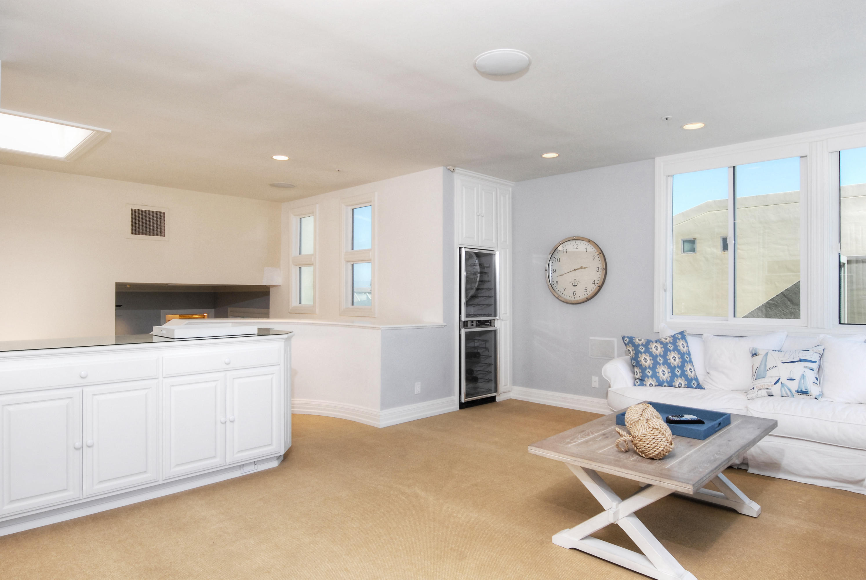 681 Mandalay Beach Road Oxnard, CA 93035 - Photo 20 of 39 a living room with a furniture and a clock