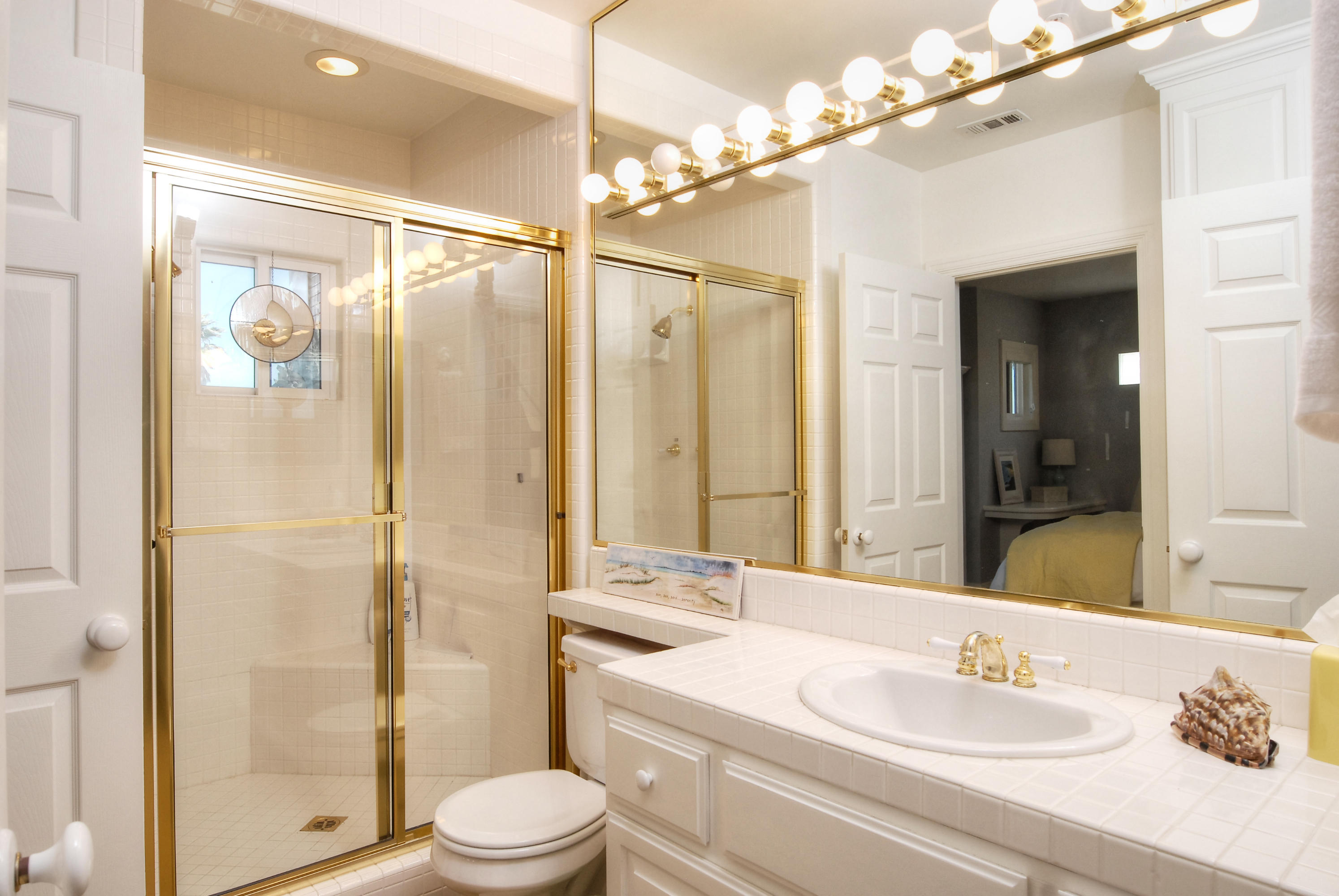 681 Mandalay Beach Road Oxnard, CA 93035 - Photo 25 of 39 a bathroom with a sink a toilet and shower