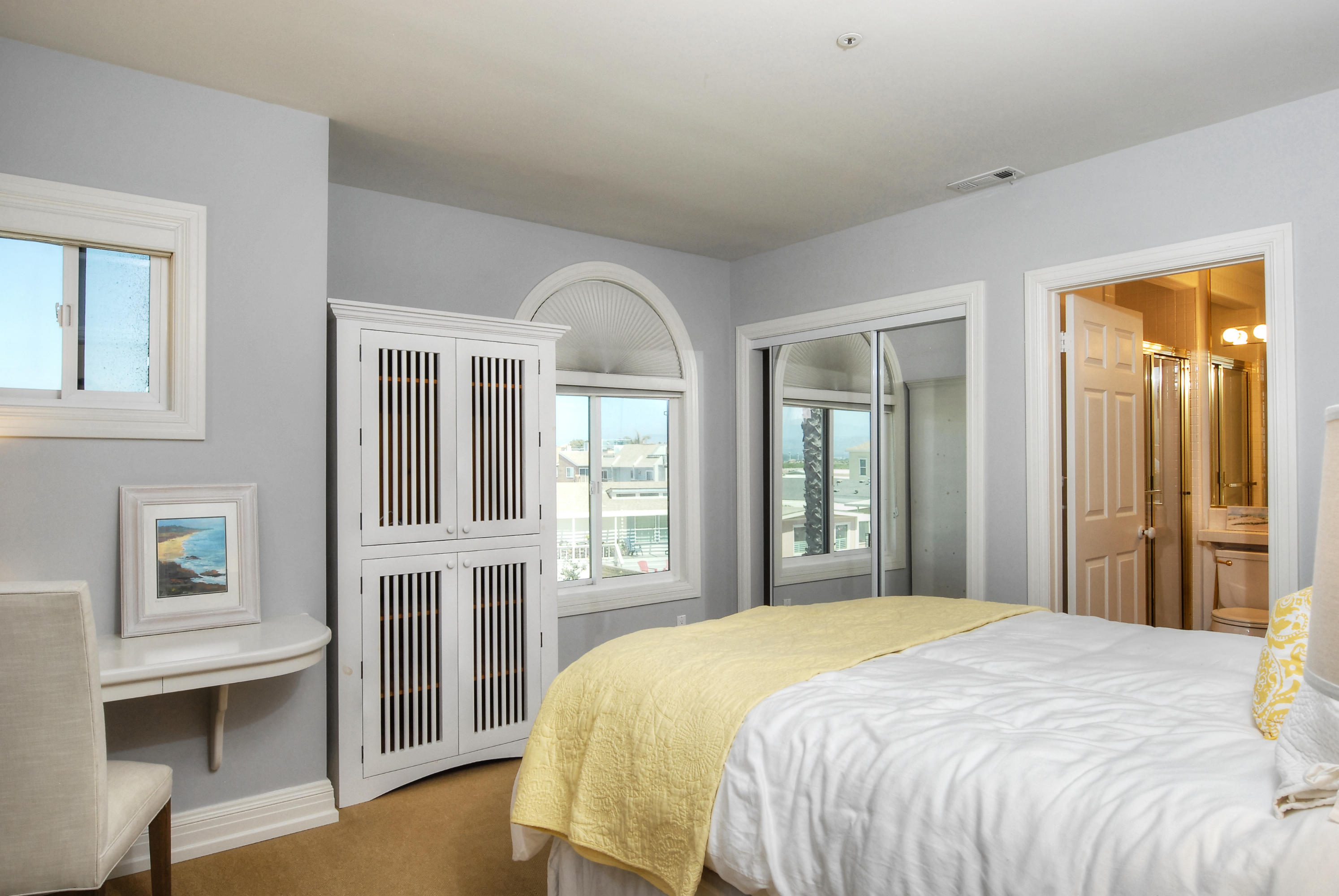 681 Mandalay Beach Road Oxnard, CA 93035 - Photo 26 of 39 a bedroom with a bed and a large window