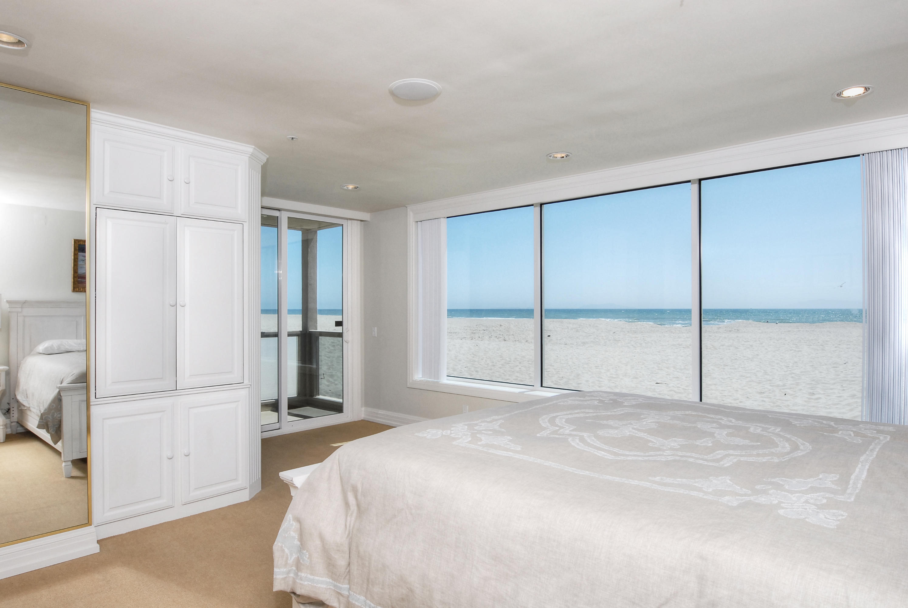681 Mandalay Beach Road Oxnard, CA 93035 - Photo 28 of 39 a spacious bedroom with a large bed and a large window