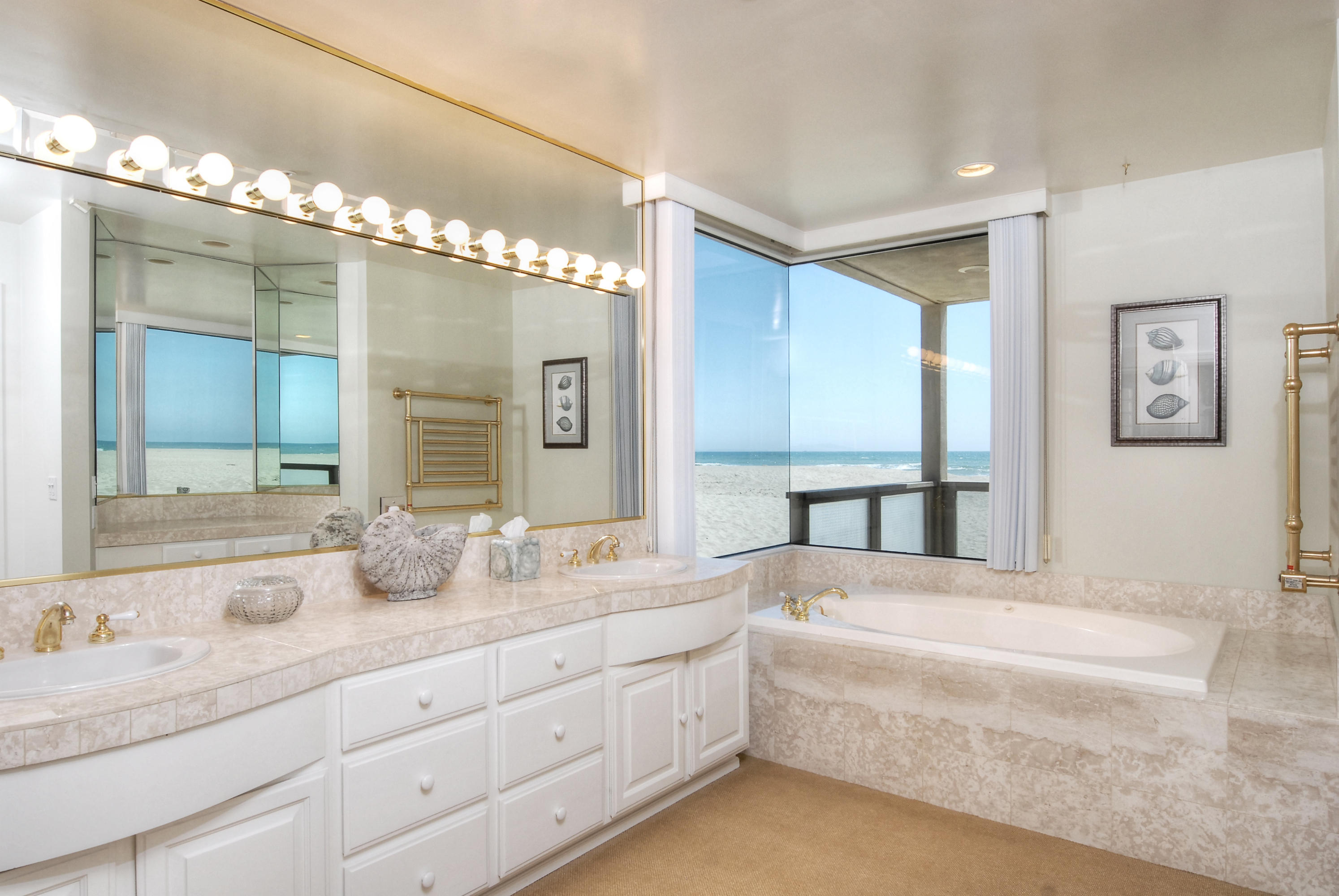 681 Mandalay Beach Road Oxnard, CA 93035 - Photo 30 of 39 a spacious bathroom with double sink and a large mirror