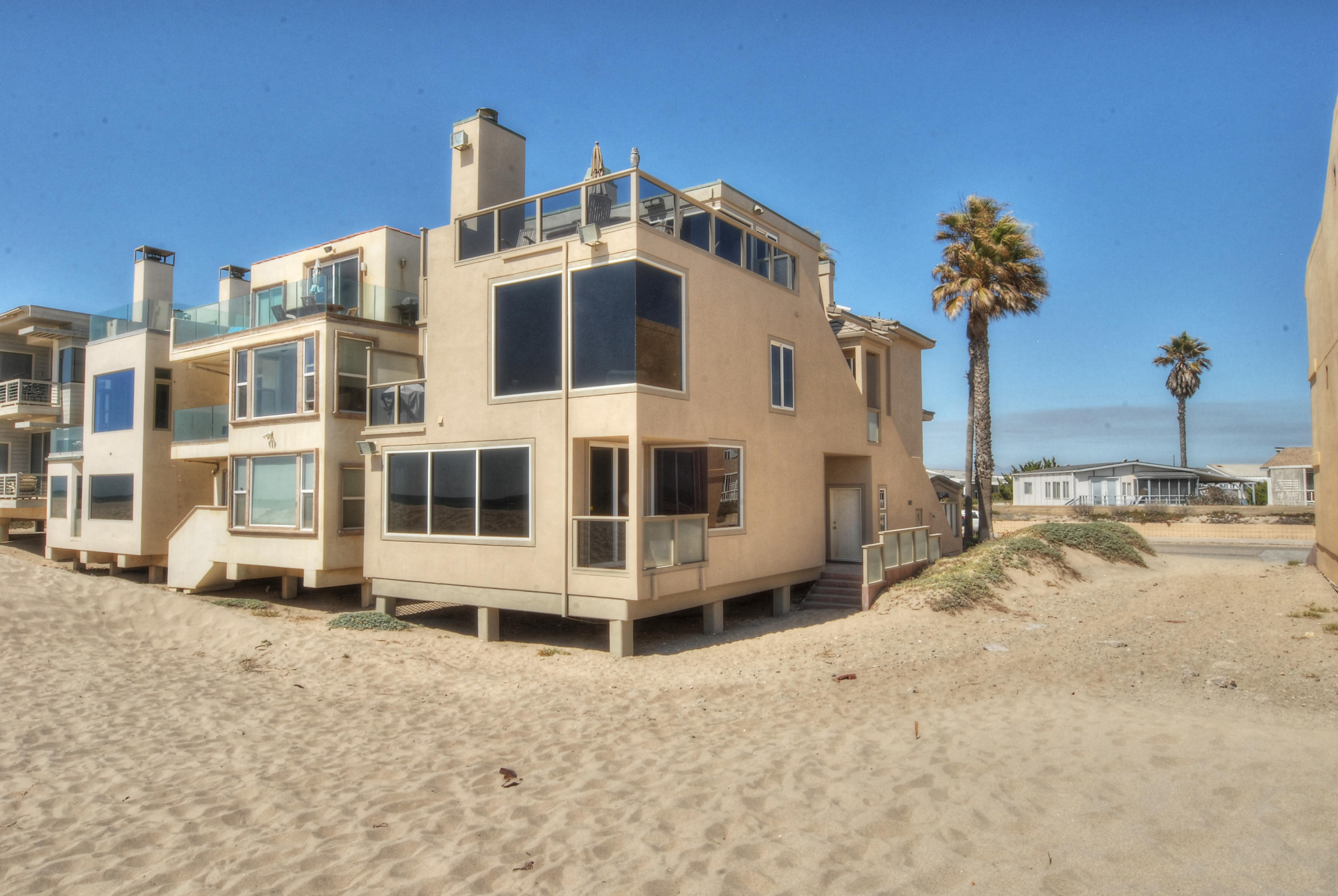 681 Mandalay Beach Road Oxnard, CA 93035 - Photo 37 of 39 a view of a blue white building with large windows
