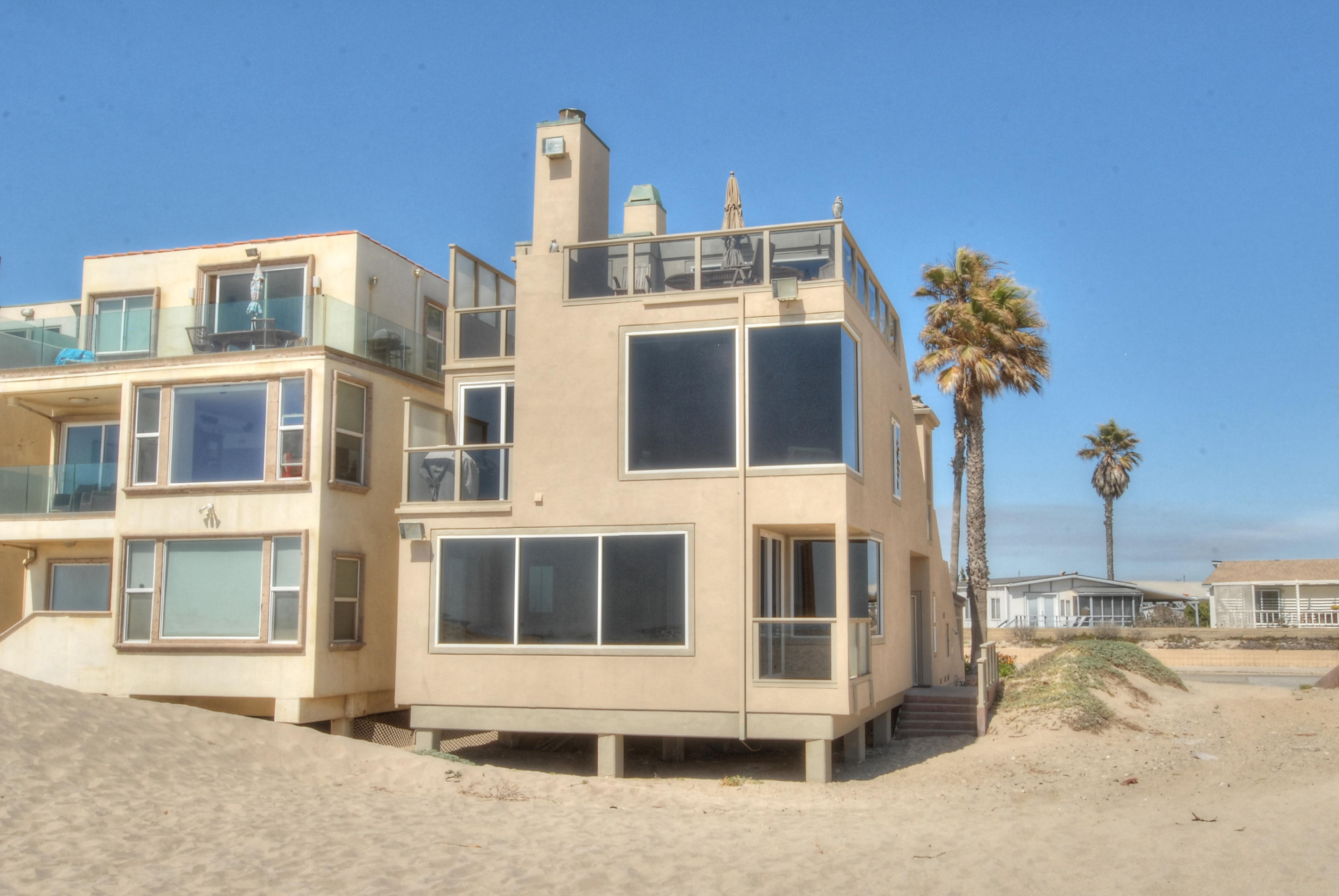681 Mandalay Beach Road Oxnard, CA 93035 - Photo 38 of 39 a front view of a building with a yard