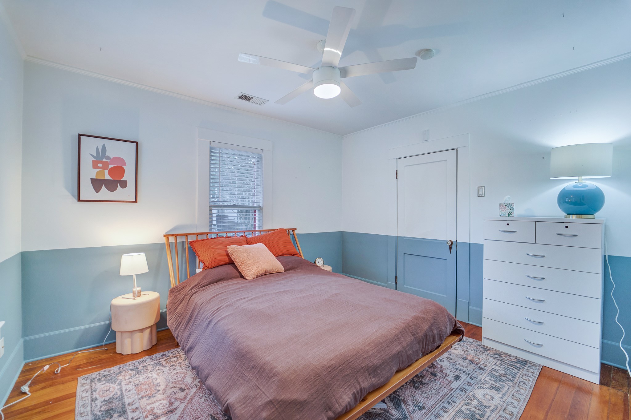 501 West 41st Street Austin, TX 78751 - Photo 13 of 18 a bedroom with a bed and a dresser