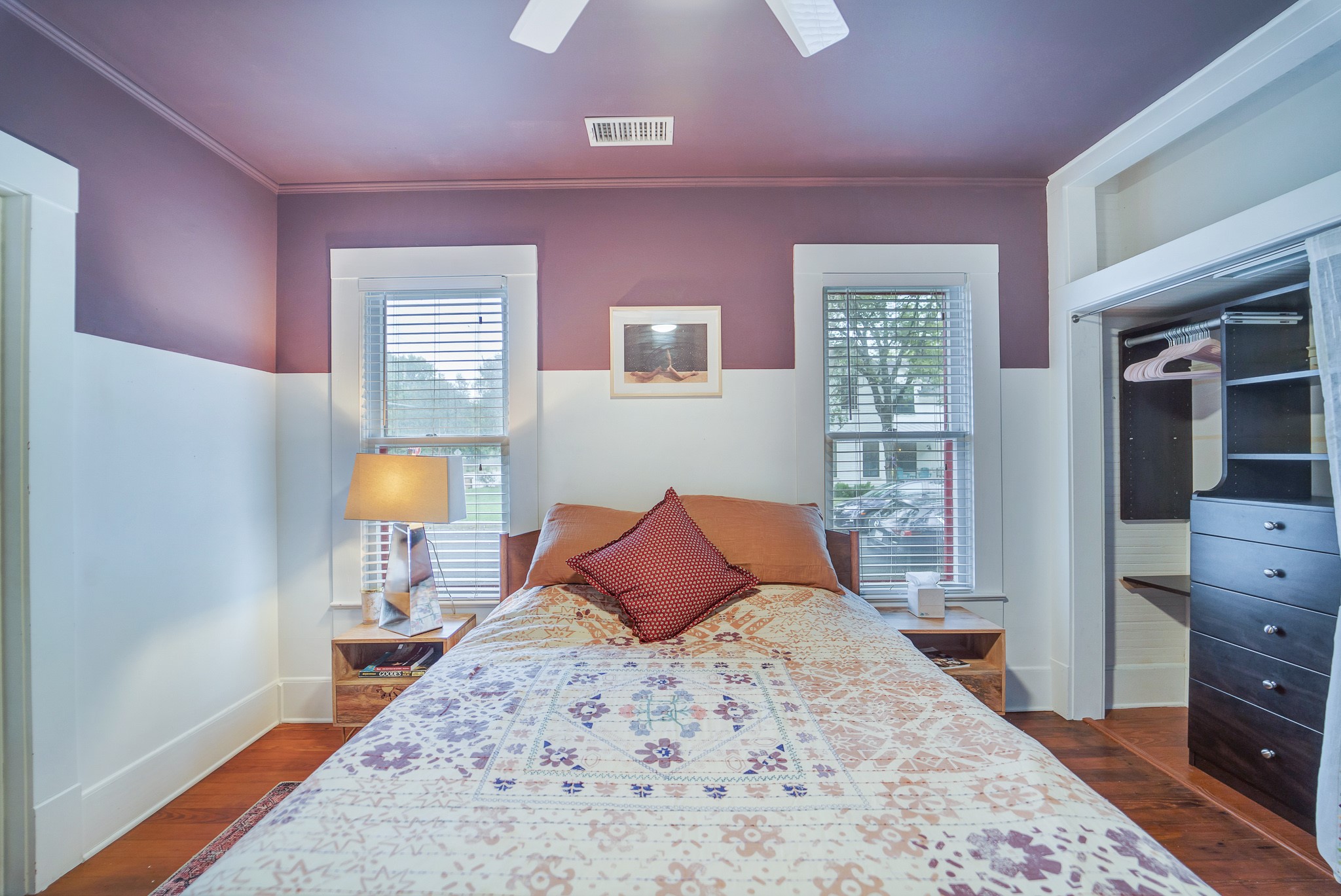 501 West 41st Street Austin, TX 78751 - Photo 14 of 18 a bedroom with a bed and wooden floor