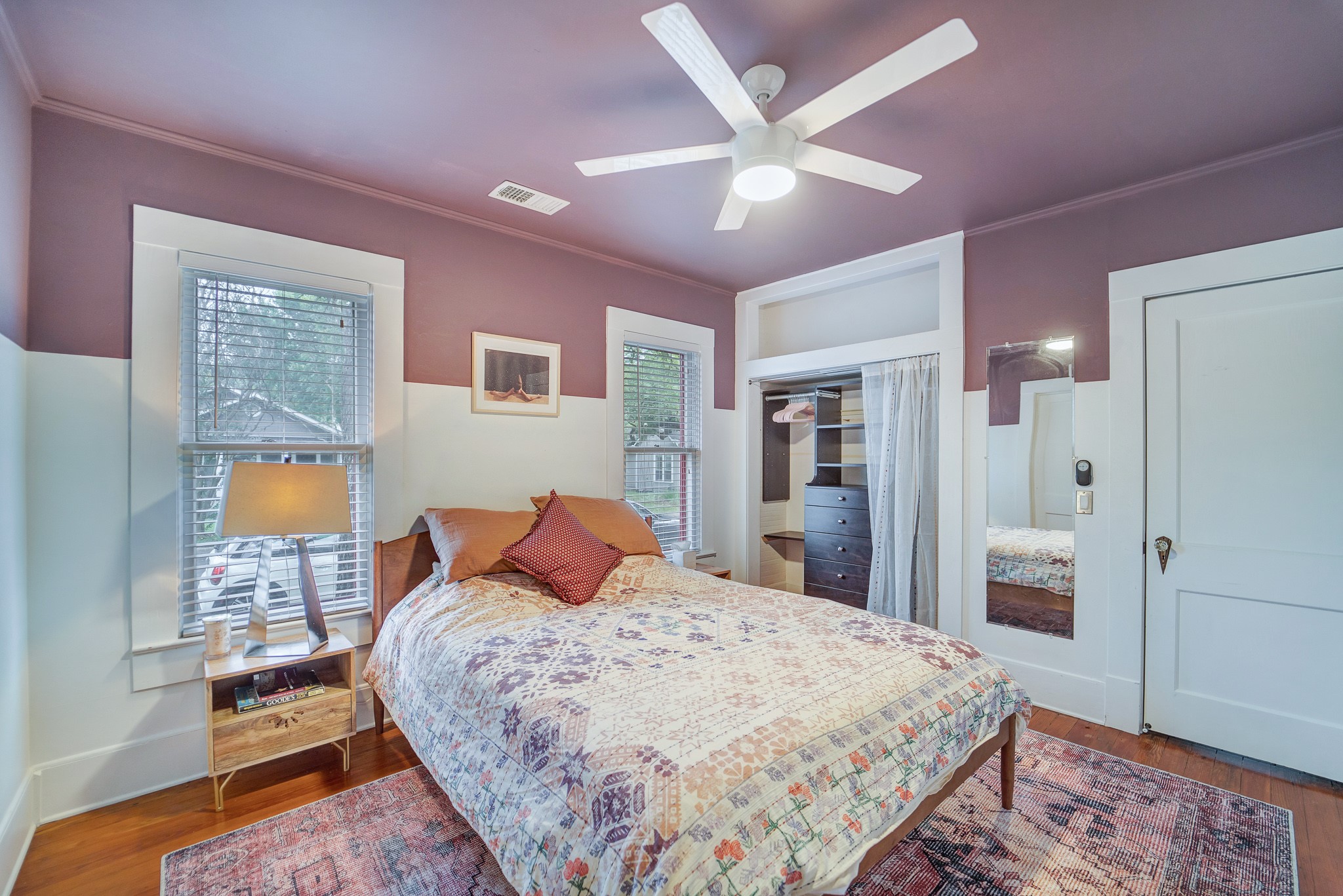 501 West 41st Street Austin, TX 78751 - Photo 15 of 18 a bedroom with a large bed and a chandelier