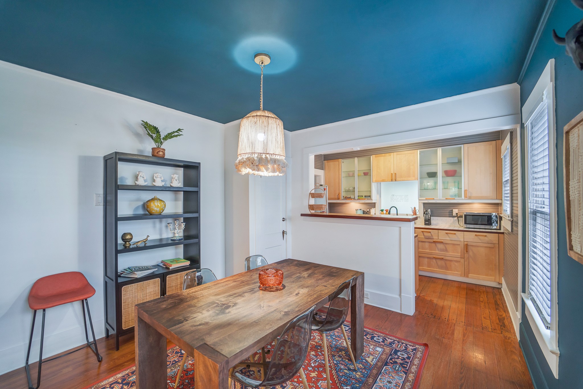 501 West 41st Street Austin, TX 78751 - Photo 6 of 18 a view of a dining room with furniture window and wooden floor