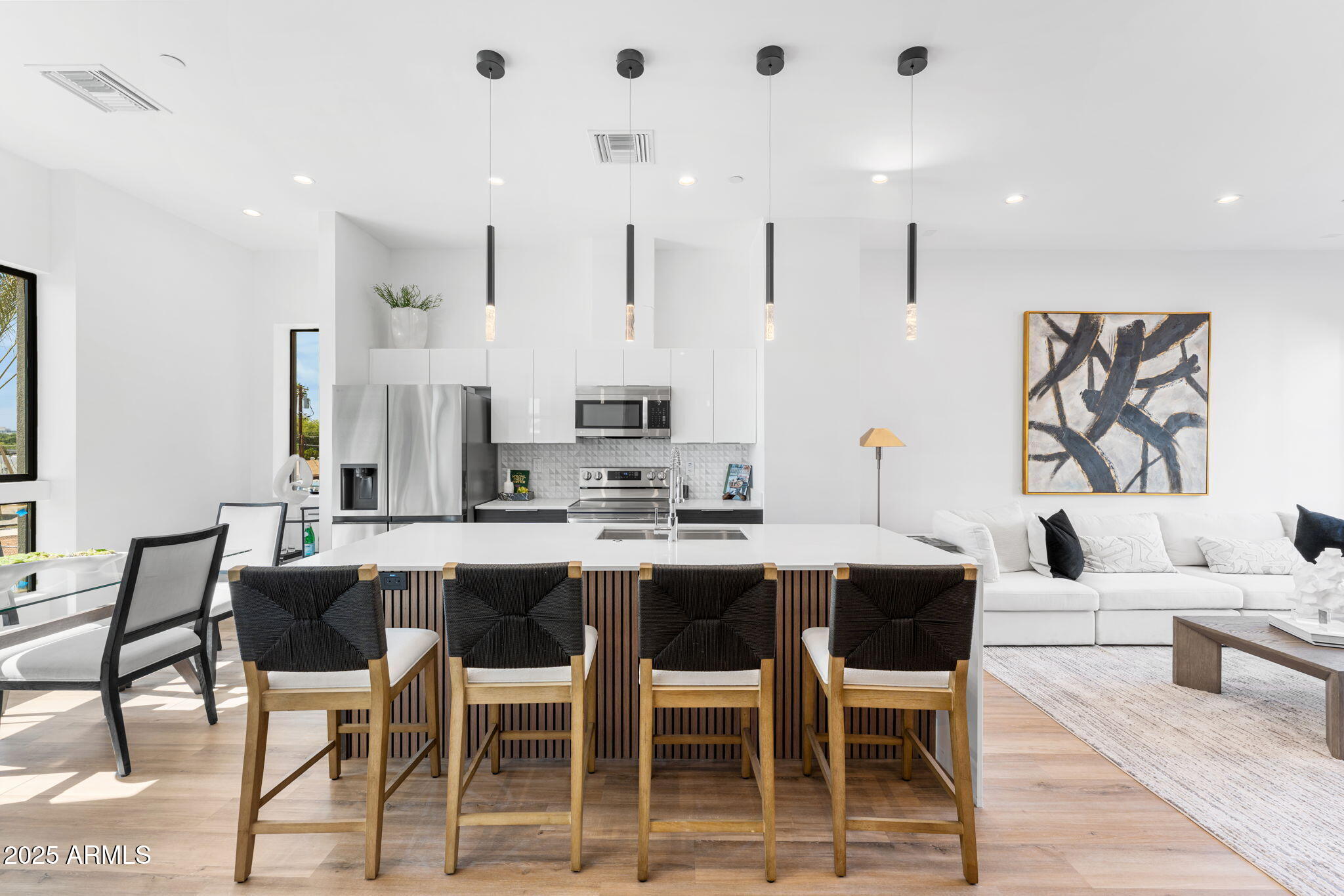 4220 North 32nd Street, Unit 7 Phoenix, AZ 85016 - Photo 11 of 35 a dining room with stainless steel appliances kitchen island granite countertop a dining table chairs and view living room