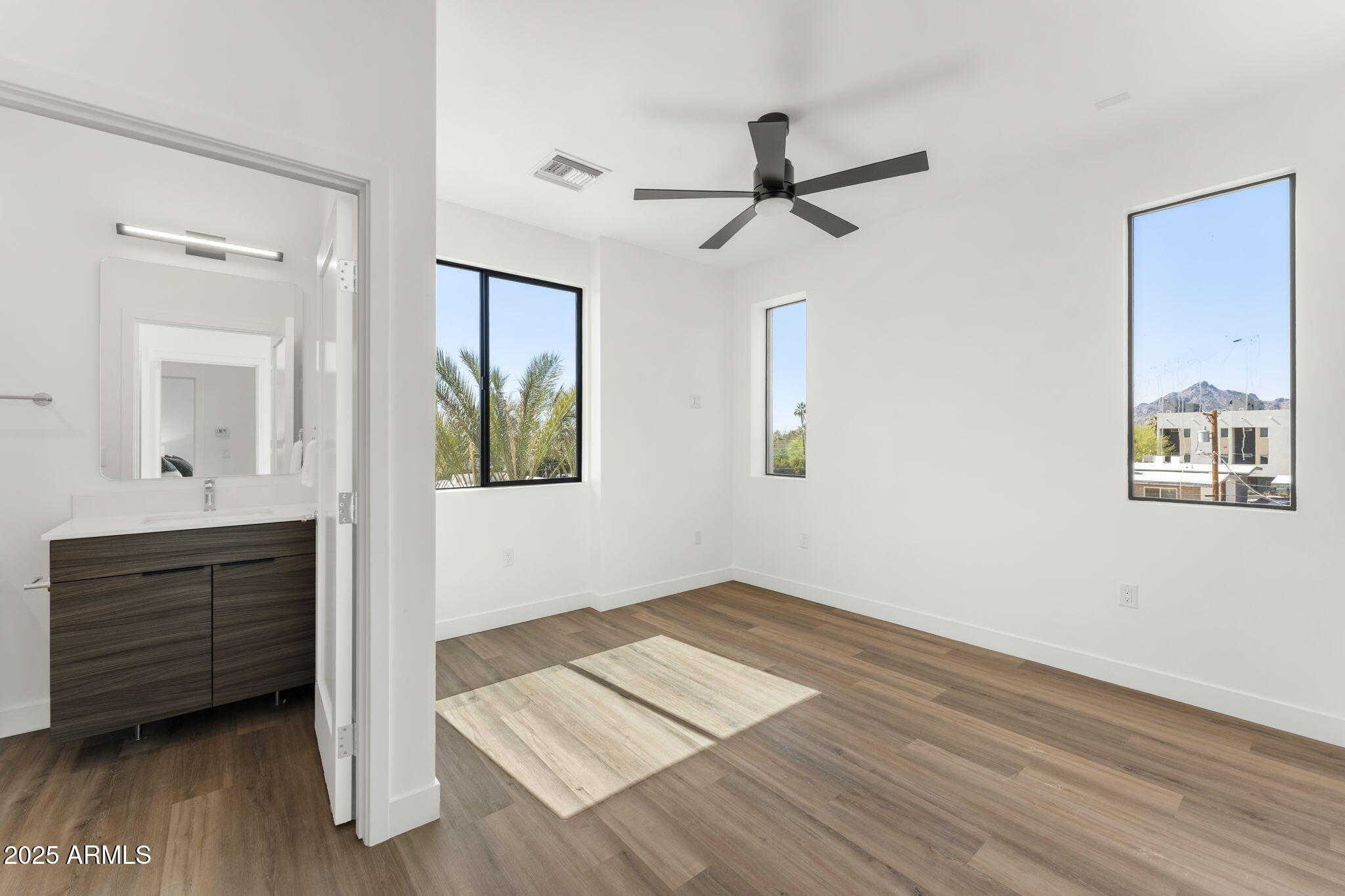 4220 North 32nd Street, Unit 7 Phoenix, AZ 85016 - Photo 22 of 35 a view of a hallway with wooden floor and cabinet