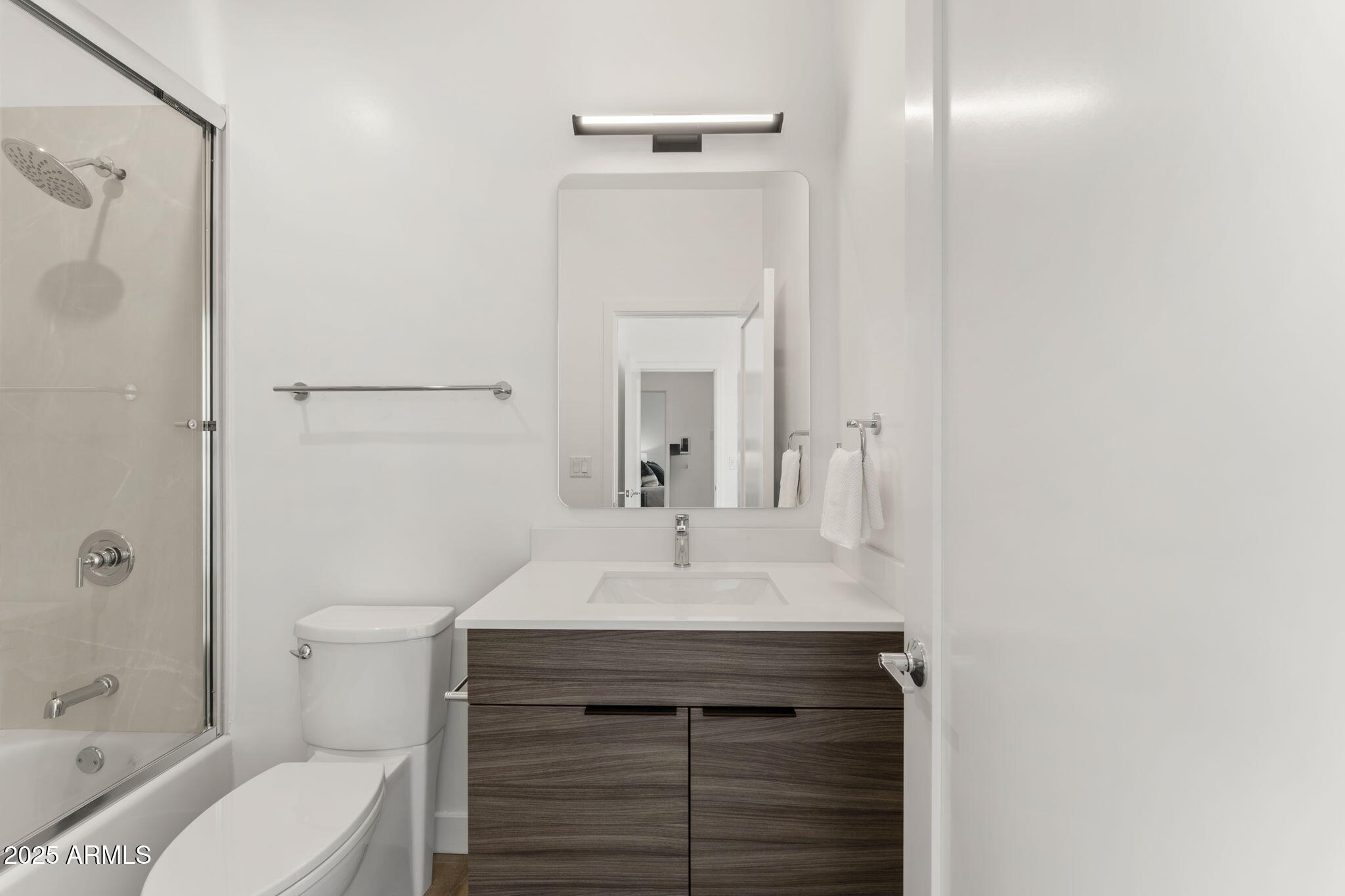 4220 North 32nd Street, Unit 7 Phoenix, AZ 85016 - Photo 23 of 35 a bathroom with a sink toilet vanity and shower