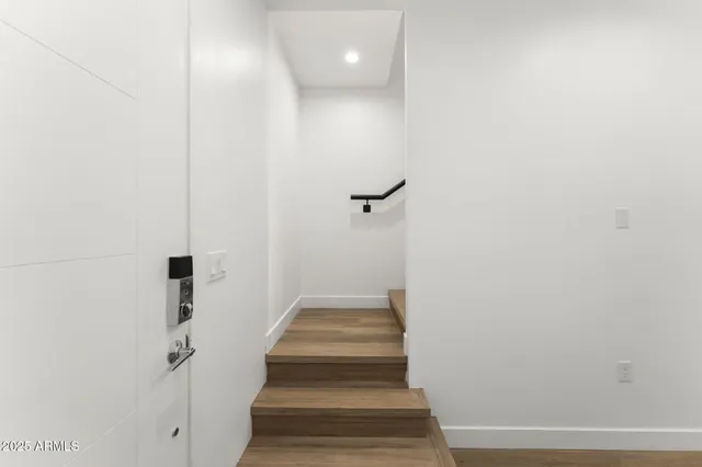 a view of staircase with white walls