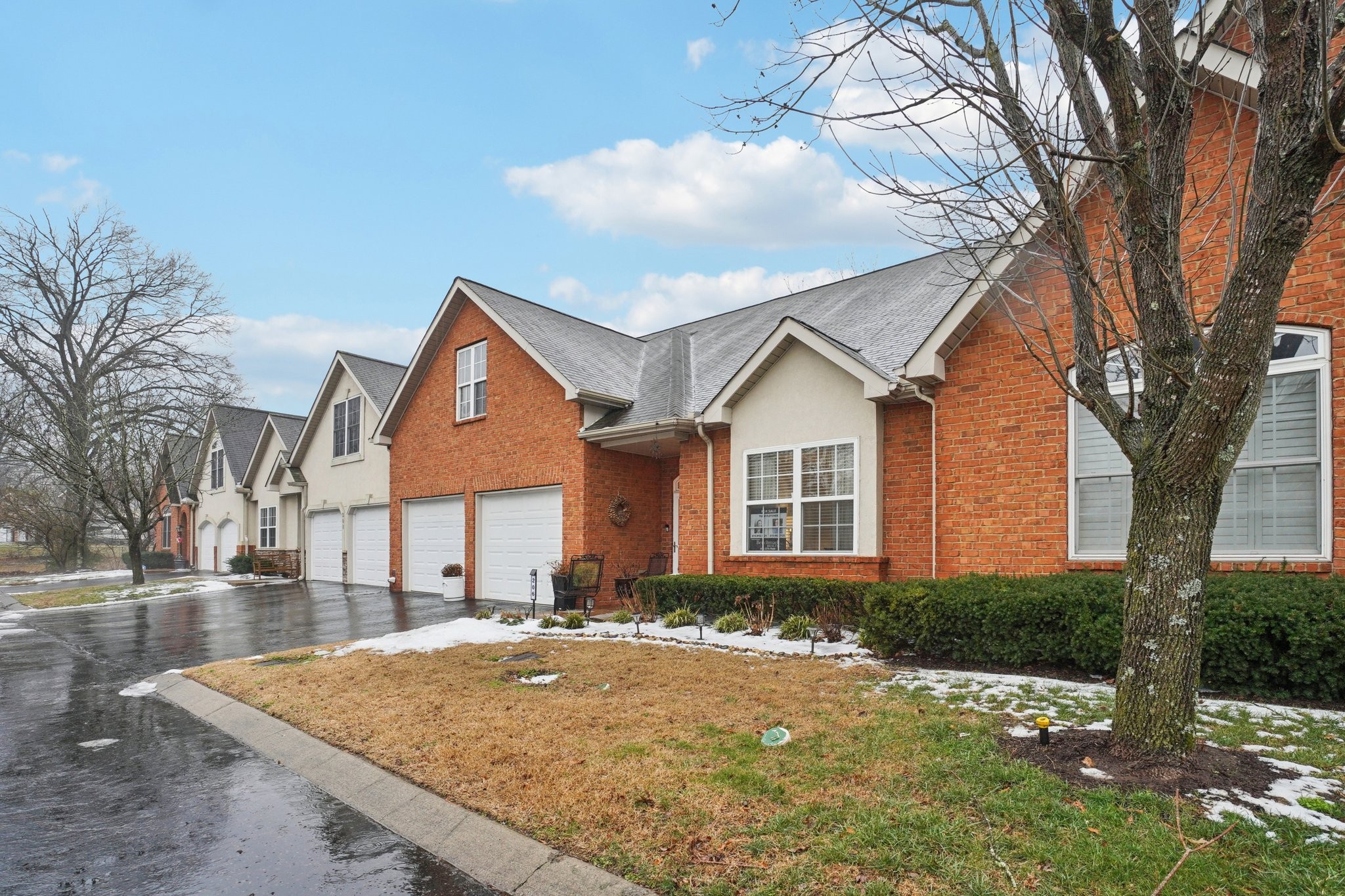 2521 Pennington Bend Road, Unit 206 Nashville, TN 37214 - Photo 15 of 34 a view of a white house next to a road and yard