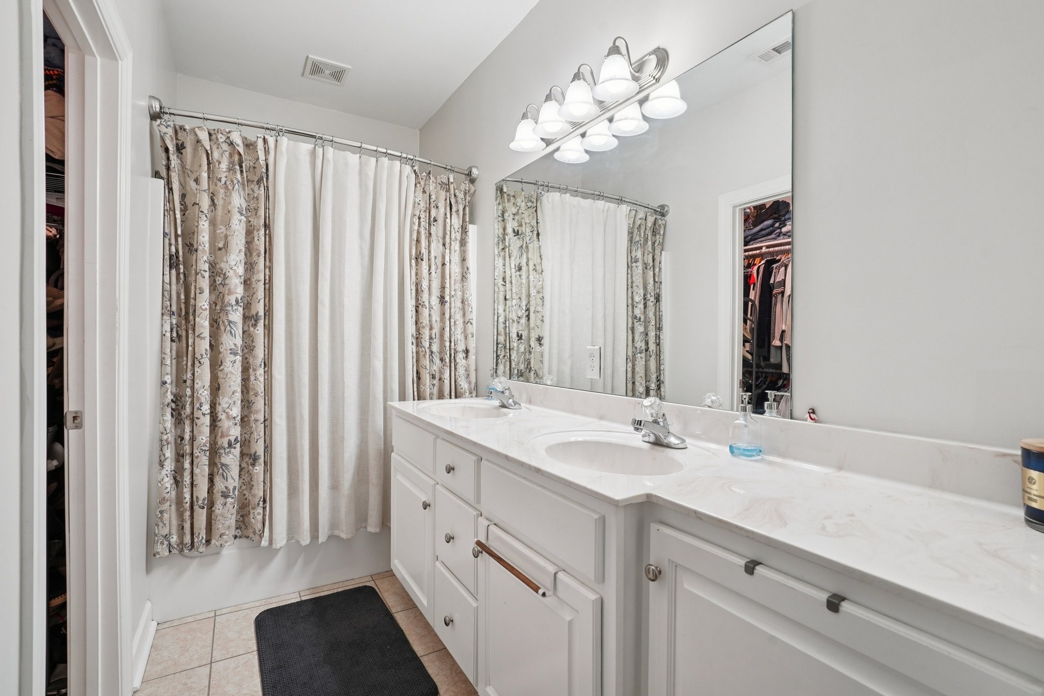 2521 Pennington Bend Road, Unit 206 Nashville, TN 37214 - Photo 23 of 34 a bathroom with a sink vanity and a mirror