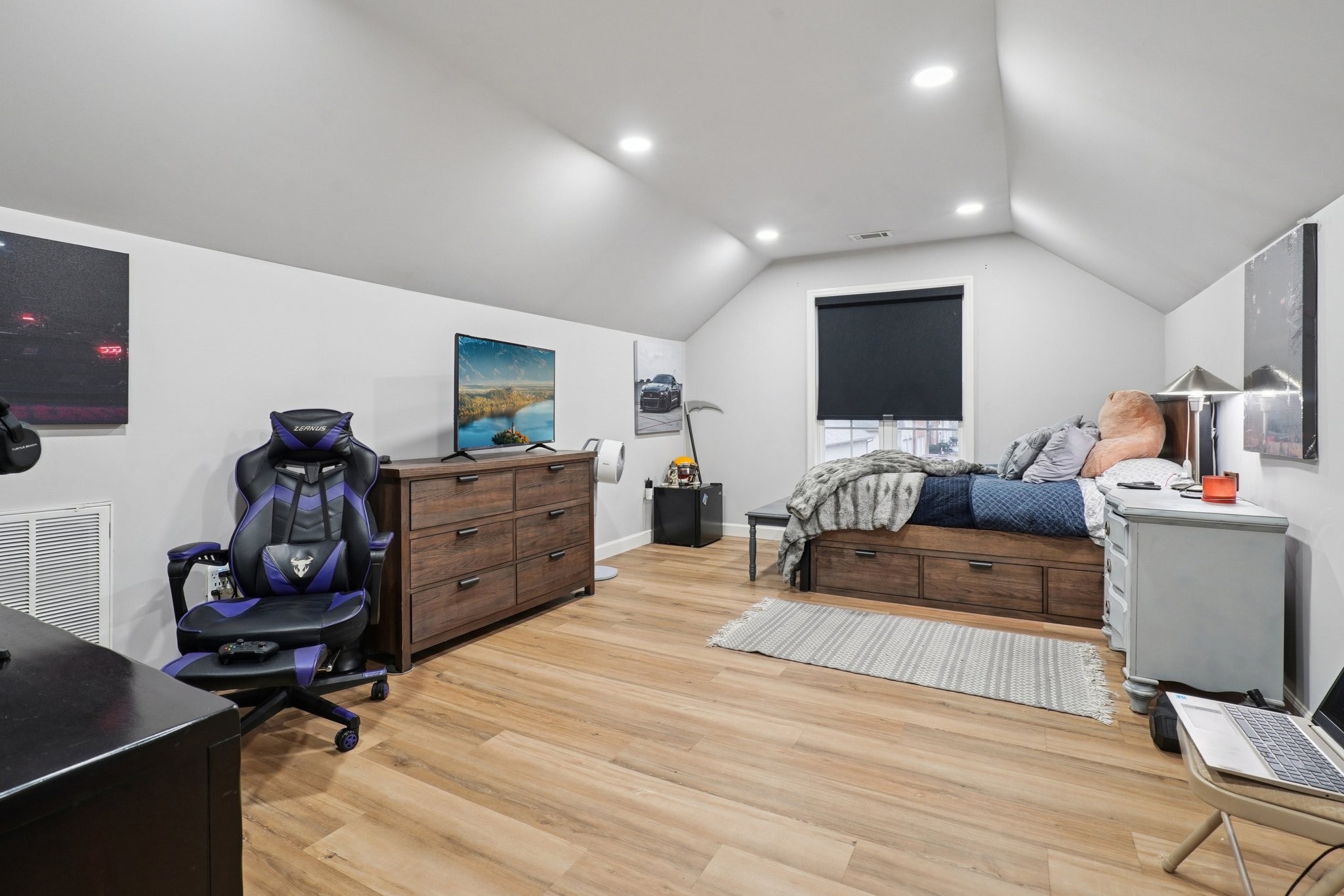 2521 Pennington Bend Road, Unit 206 Nashville, TN 37214 - Photo 24 of 34 a bedroom with furniture and a flat screen tv