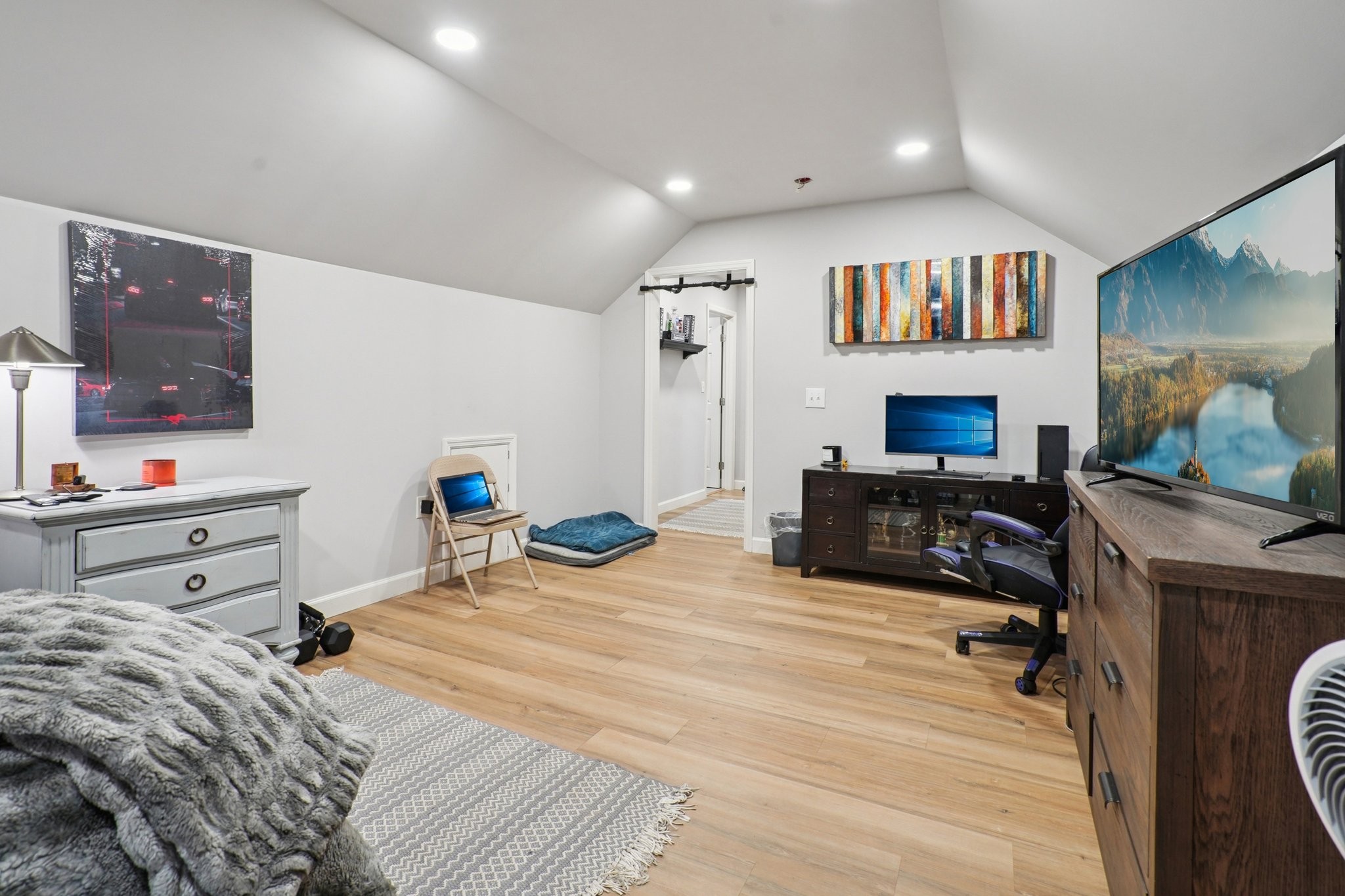 2521 Pennington Bend Road, Unit 206 Nashville, TN 37214 - Photo 25 of 34 a bedroom with furniture and a flat screen tv