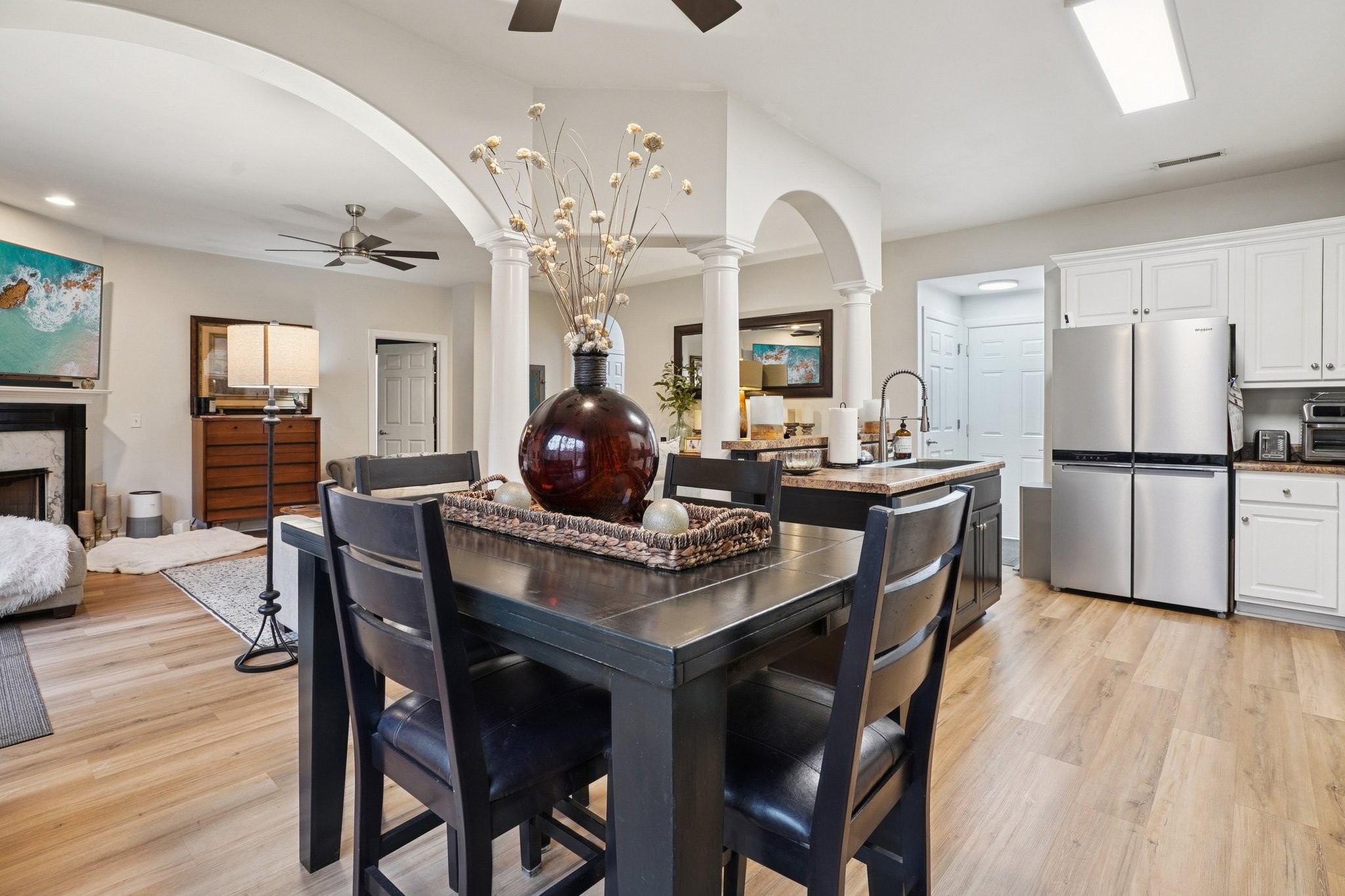 2521 Pennington Bend Road, Unit 206 Nashville, TN 37214 - Photo 3 of 34 a kitchen with a table chairs refrigerator and cabinets